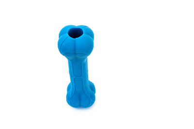 Close-up of blue toy against white background