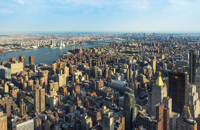 High angle view of city buildings against sky