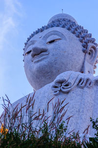 Low angle view of statue against sky