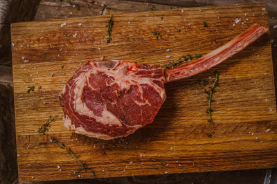 Close-up of red chili peppers on cutting board