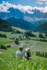 High angle view of people on field against mountains