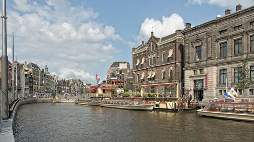 Cruising boats on a river in amsterdam netherlands