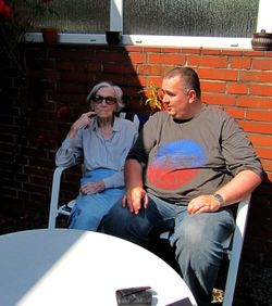 Young couple sitting outdoors