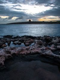 Scenic view of sea against sky at sunset