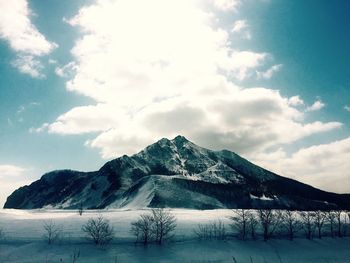 Scenic view of snowcapped mountains against sky