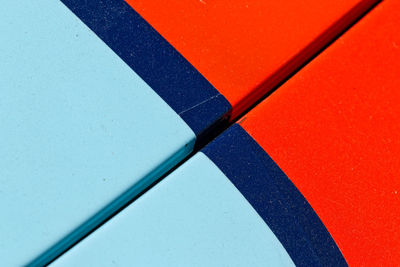 High angle view of colored pencils on table against wall