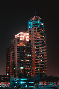 Illuminated buildings in city at night