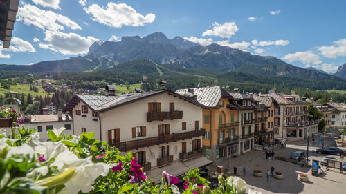 Houses in town against sky