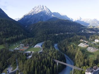 High angle view of trees and mountains against sky