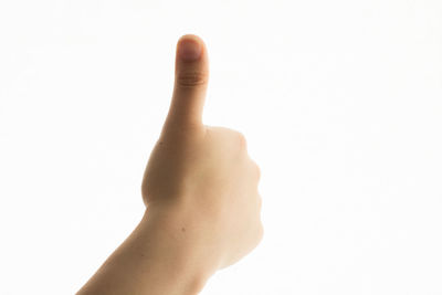 Close-up of human hand over white background