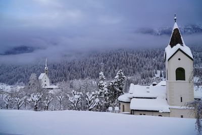 Buildings against sky during winter