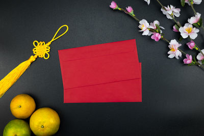 High angle view of yellow and book on paper
