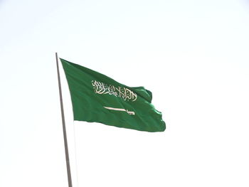 Low angle view of flag against white background