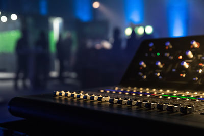 Cropped image of sound mixer in nightclub