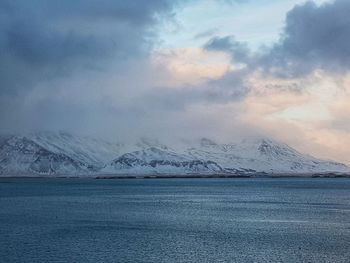 Scenic view of frozen lake against sky