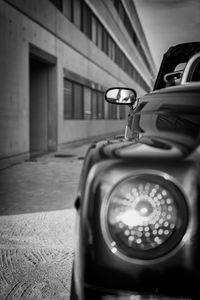 Close-up of car on street