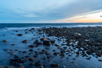 Scenic view of sea at sunset