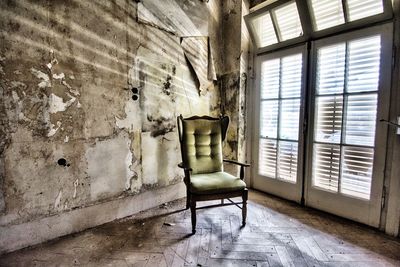 Empty chair in abandoned building