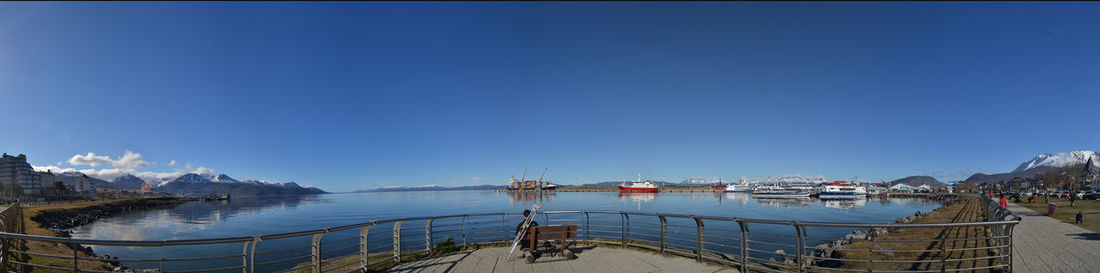 Pier over sea against blue sky