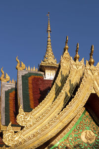 Low angle view of temple against building