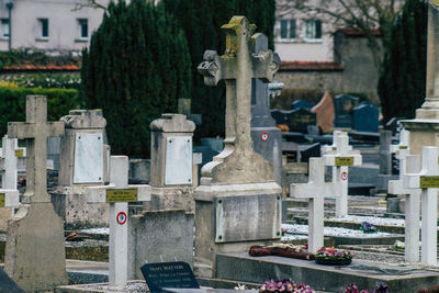 View of cemetery against built structures