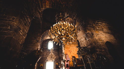 Low angle view of illuminated ceiling of building