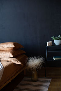 Open book on table against wall at home