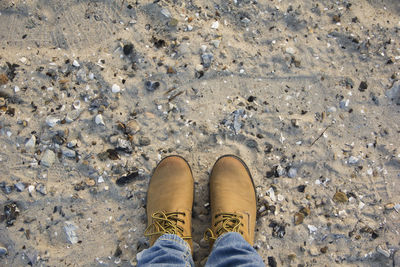 Low section of woman standing on ground