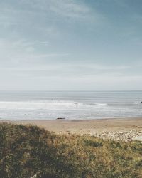 Scenic view of beach against sky