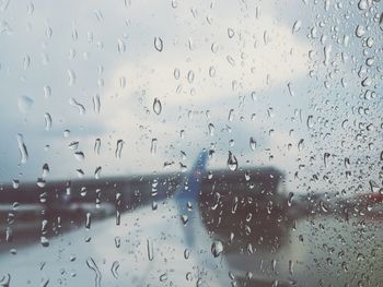 Full frame shot of wet glass window in rainy season