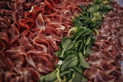 Full frame shot of chopped vegetables and cured meat