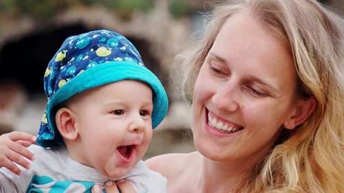 Portrait of smiling girl with mother