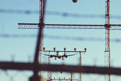 Close-up of metal fence against sky