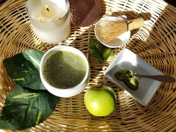 High angle view of fruits in basket on table