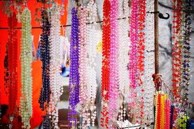 Close-up of colorful bead necklace for sale in market