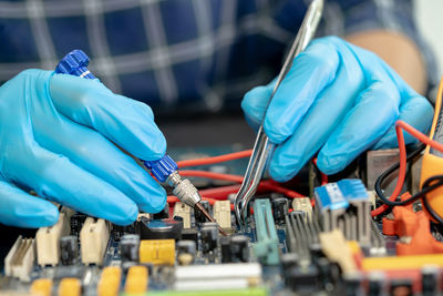 Cropped hand of scientist examining chemical