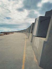 Road by sea against sky