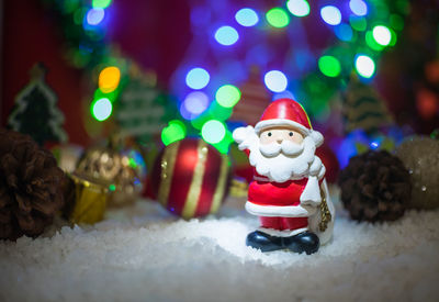 Close-up of christmas decorations on snow