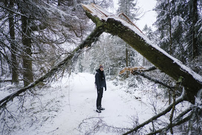 Full length of woman on snow covered land