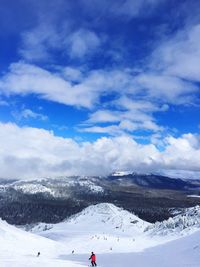 Scenic view of snow covered mountains against sky