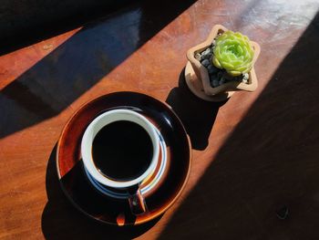 High angle view of black coffee on table