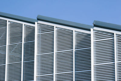 Low angle view of building against clear blue sky