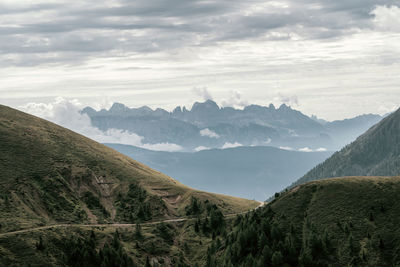 Scenic view of landscape and mountains against sky