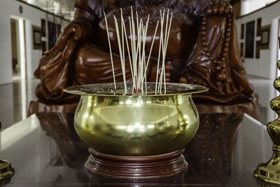 Close-up of buddha statue in temple