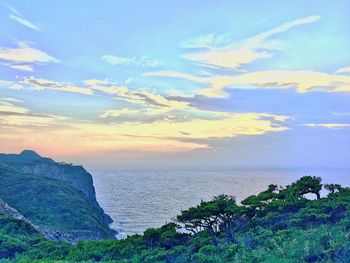 Scenic view of sea against cloudy sky