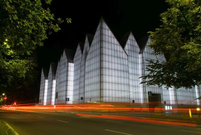 Light trails on road in city at night