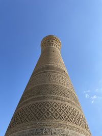 Low angle view of statue against clear blue sky