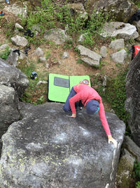 Close-up of woman on rock