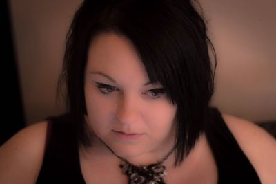 Close-up of thoughtful woman at home