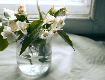 Close-up of white flower vase on table